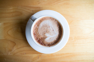 hot coffee mocha with foam milk in countryside cafe