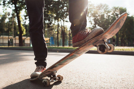 Skater make olly trick exercise. Flicking and stand practice.