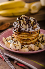 American pancakes with banana, chocolate
