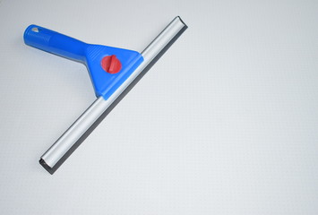 A blue squeegee 