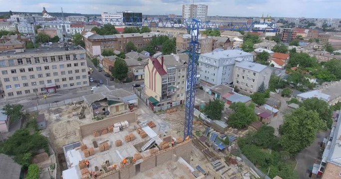 Aerial view of multi-storey building construction at summer time