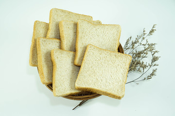 Breads in old basket top view isolated