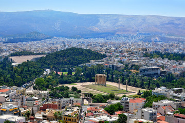 Fototapeta premium Panoramic view of Athens and the famous temple of Olympian Zeus from the Acropolis on a summer sunny day.