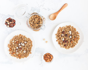 Breakfast with muesli, nuts on white background. Healthy food concept. Flat lay, top view