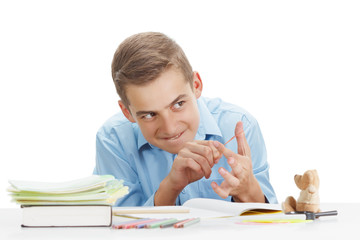 Funny child is naughty reading a book at School.