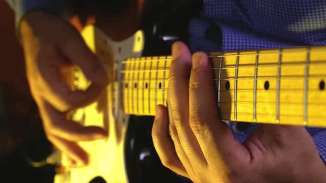 Guitarist plays blues at the warm club live set close-up