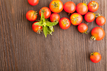 tomato with basil on wood table
