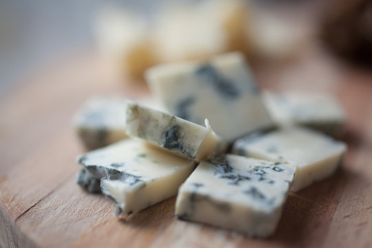 cheese dorblu lying on a wooden platter
