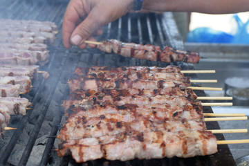 meat skewers on hot grill