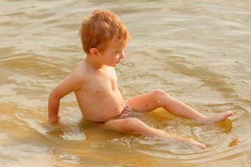 Child swimming lake.