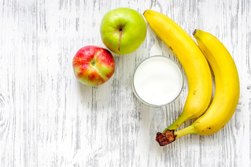 Kids breakfast with fruits on light wooden table background top view copyspace