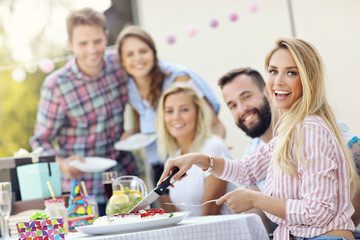 Group of friends having fun at birthday party