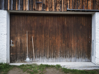 garage door with garden equipment