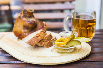 shin, knee wild boar - roast pork leg with vegetables and beer