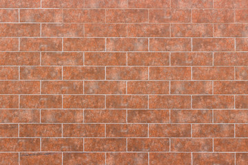 The wall is covered with tiles. Background, texture, wallpaper.