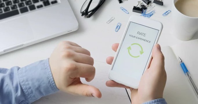 Man gives five star rating using smartphone application