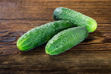 Cucumbers on old wooden table