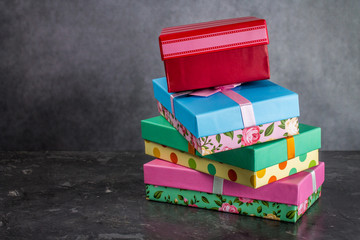 Gift boxes on concrete gray dark background