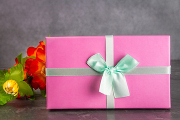 Gift boxes on concrete gray dark background