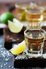 Tequila golden with lime and sea salt decorated with blackberry and mint