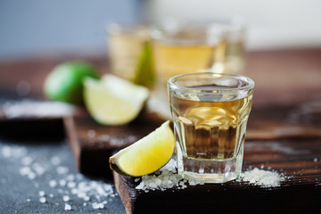 Tequila golden with lime and sea salt decorated with blackberry and mint