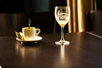 Coffee shop table with cup and glass