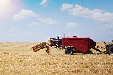 Obraz premium The tractor makes a haystack