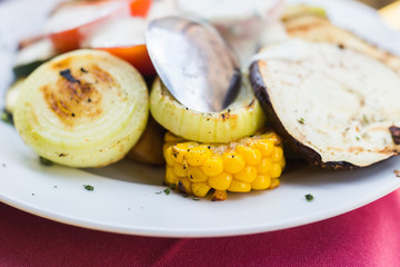 Delicious grilled vegetables on plate on table close-up