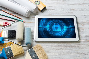 Web security and technology concept with tablet pc on wooden table