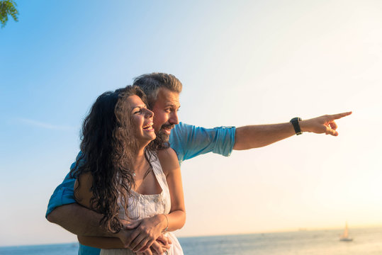 Man pointing with his wife