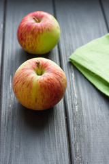 Ripe red apples on wooden background