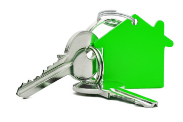 Estate concept, green key ring  and keys on isolated background