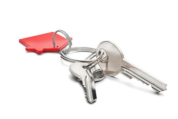 Estate concept, red key ring  and keys on isolated background