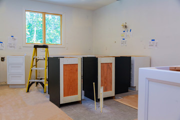 Custom kitchen cabinets in various stages of installation
