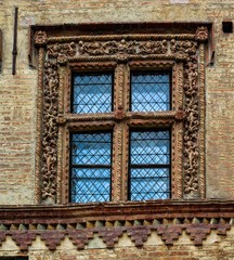 Fototapeta na wymiar Engraved Italian window, medieval window