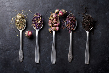 Assortment of dry tea in spoons