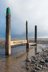 cleveleys, england, 02/17/2016, A rustic, weathered wooden sea defence wall, showing signs of damage...