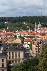 Fototapeta na wymiar View of old buildings at the Mala Strana District (Lesser Town) and Petrin Hill in Prague, Czech Republic, in the daytime.