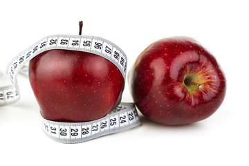ripe red apples and a tape measure