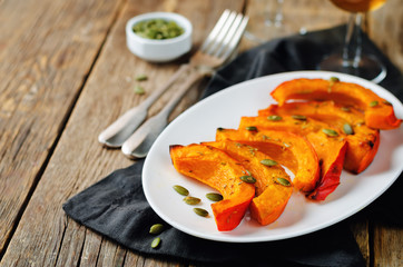 Rosemary honey roasted pumpkin wedges with pumpkin seeds
