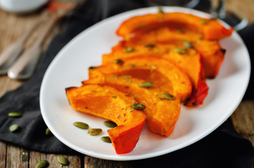 Rosemary honey roasted pumpkin wedges with pumpkin seeds
