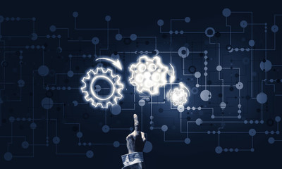 Glowing cogwheel mechanism icon on dark background as symbol of 