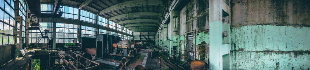 Panoramic shot of abandoned industrial factory in Efremov, Russia. Panorama of a large workshop with old and rusted equipment