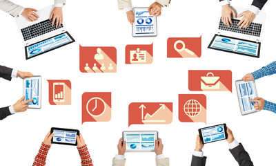 Top view of businesspeople sitting at table and using gadgets