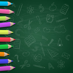 Coloured pencils on blackboard with funny doodles. Vector.