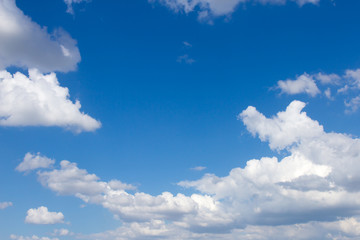 Naklejka na ściany i meble White clouds on a blue sky