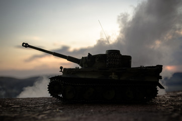 War Concept. Military silhouettes fighting scene on war fog sky background, World War German Tanks Silhouettes Below Cloudy Skyline At night. Attack scene. Armored vehicles. Tanks battle scene