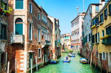Fototapeta na wymiar Scenic canal with bridge and ancient buildings in Venice, Italy.