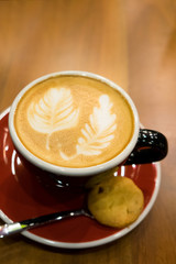 A cup of hot cappuccino or latte art coffee in morning breakfast.