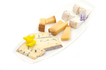 Cheese plate with different kinds of cheese with flowers.